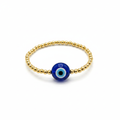 Pulsera elástica de bolitas doradas con ojo turco azul